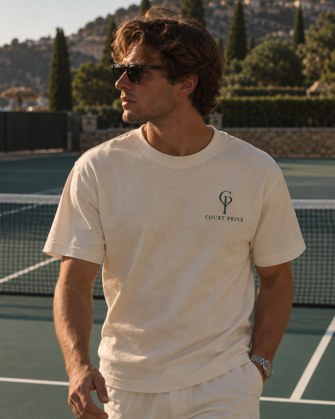 Privé Tee lifestyle model on tennis court